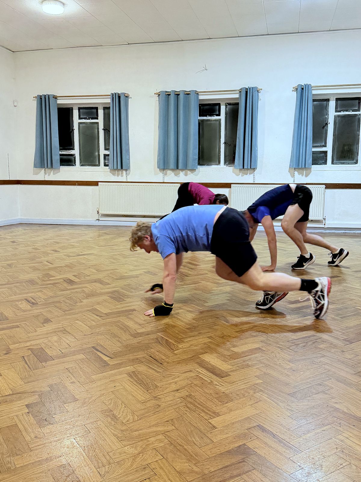 Members doing a floor conditioning exercise together