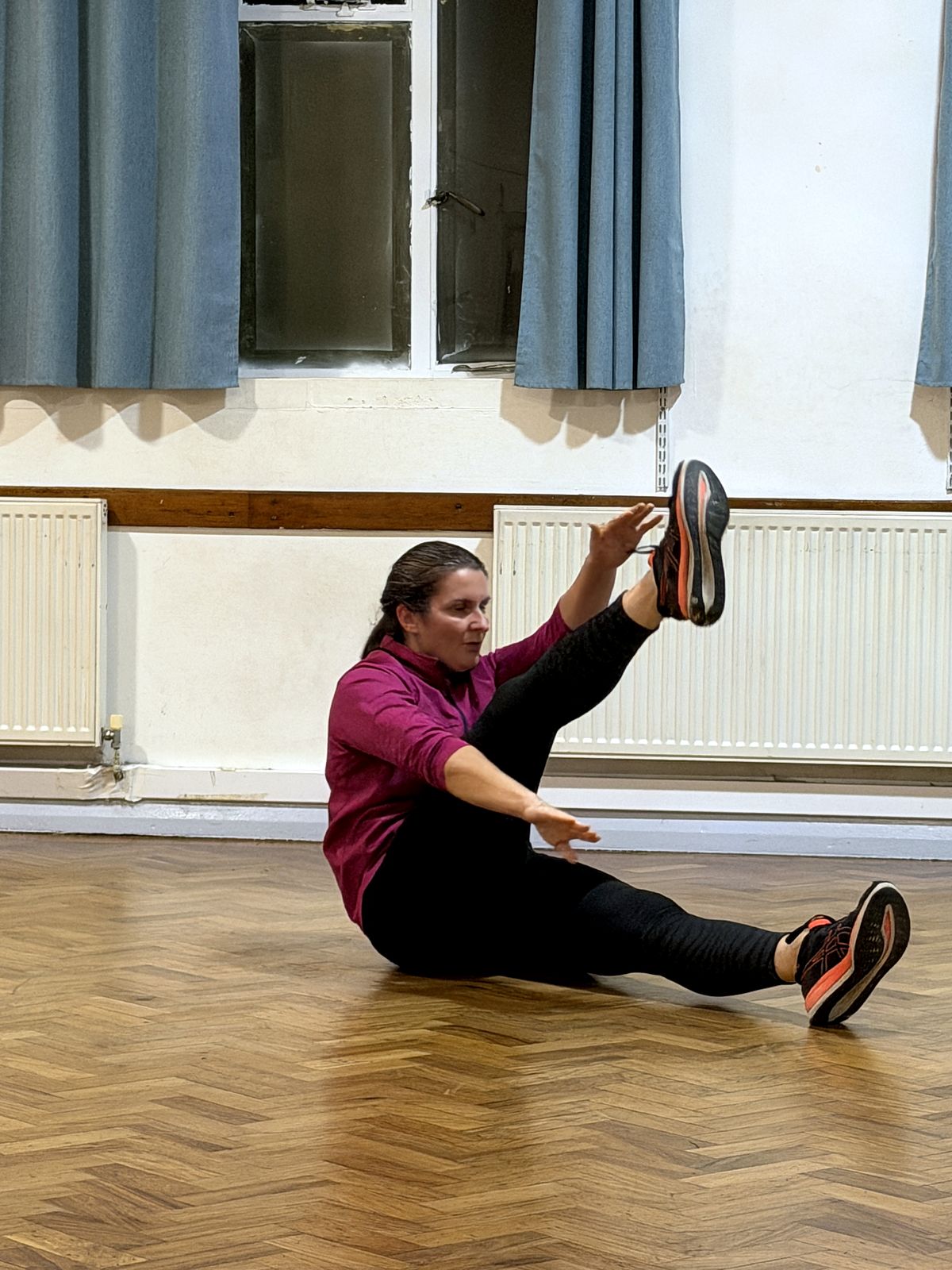 Member doing a core exercise on the floor